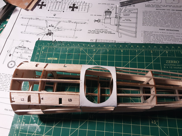 The cockpit piece installed with white glue.