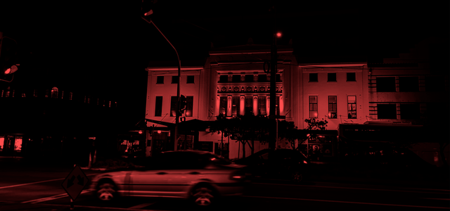 The Embassy Theatre exterior, tinted with a red filter