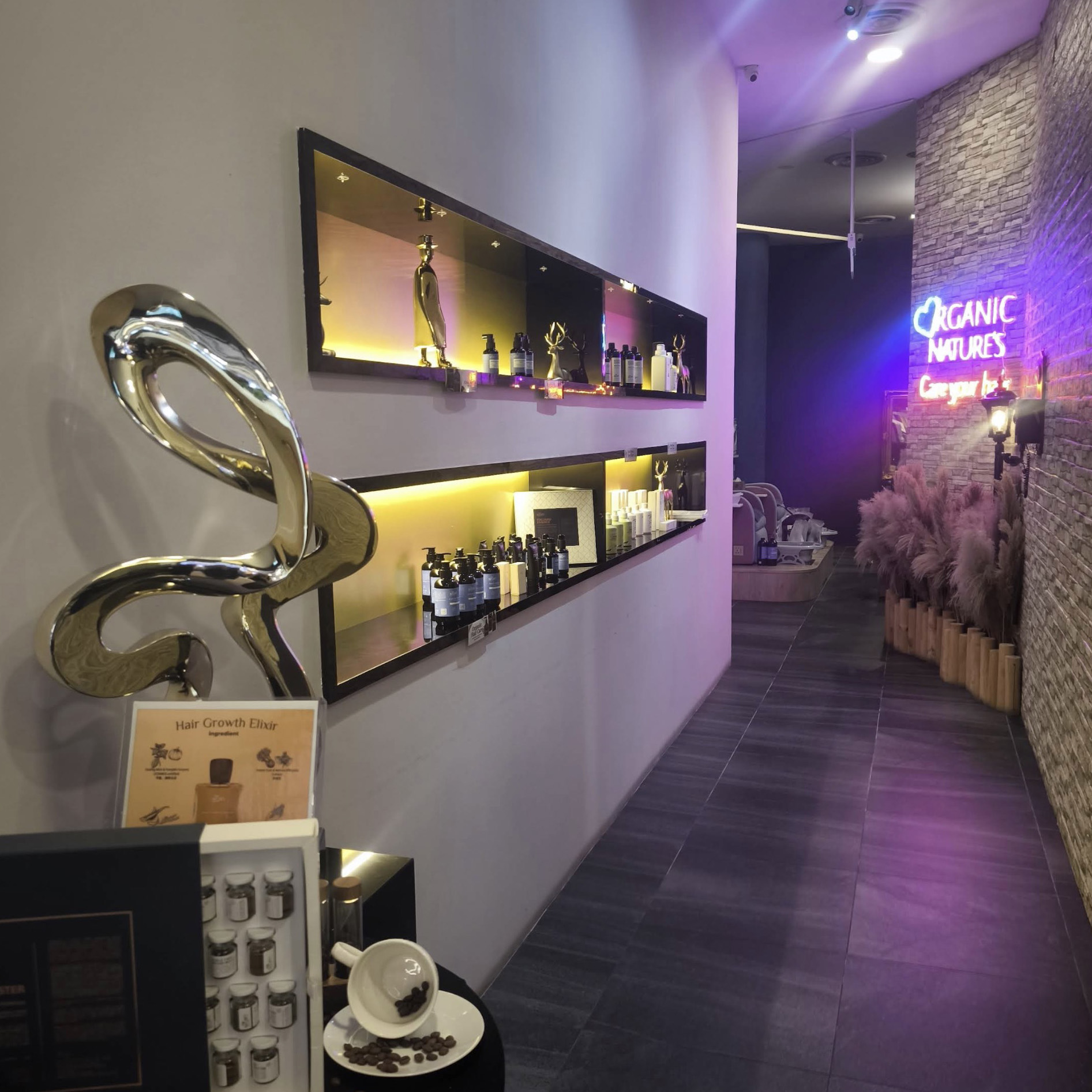Interior display shelves with hair care products and neon sign