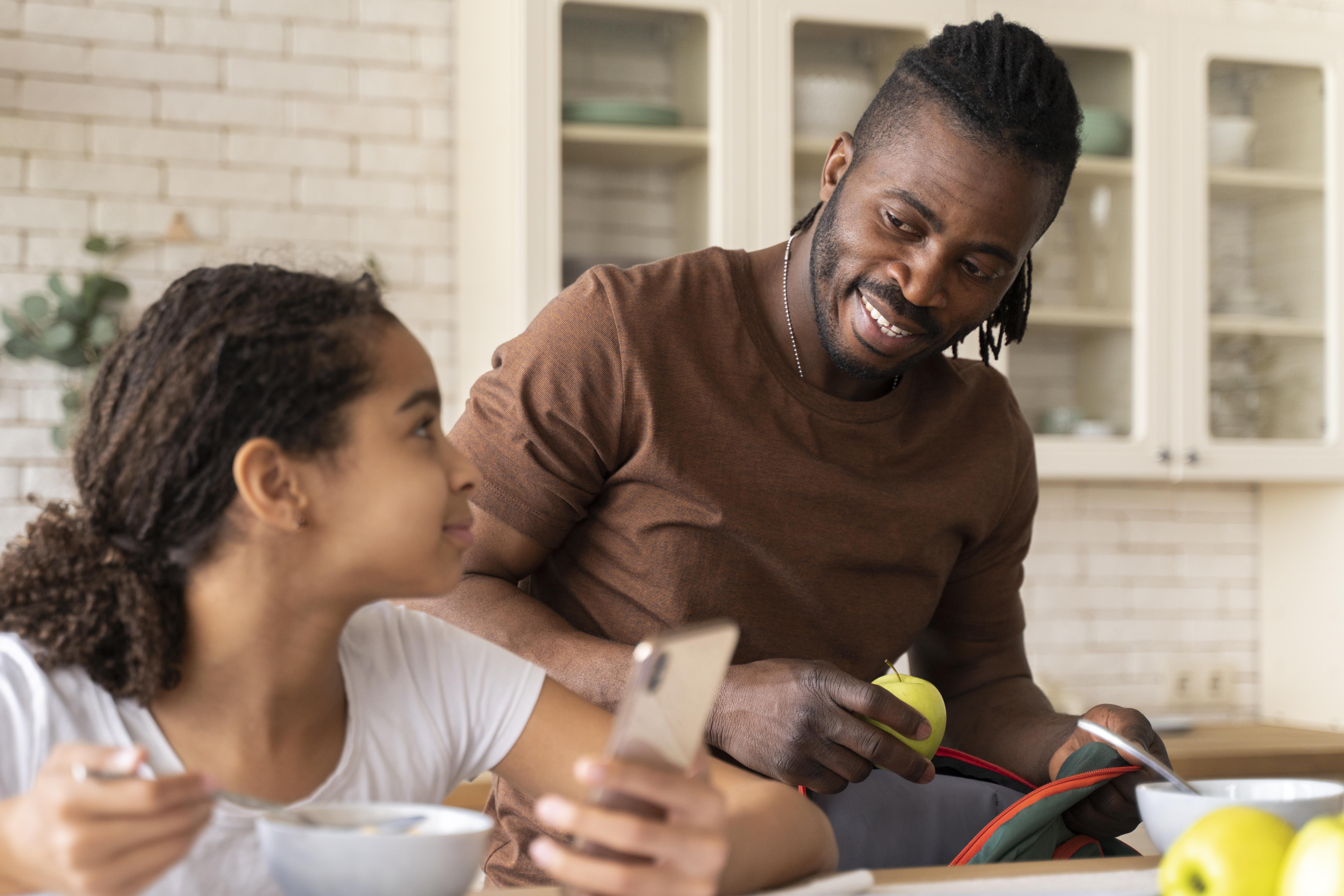 A parent and child using a tablet together during a session.