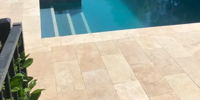 travertine pool deck installation Cape Coral Florida pavers cool surface waterfront