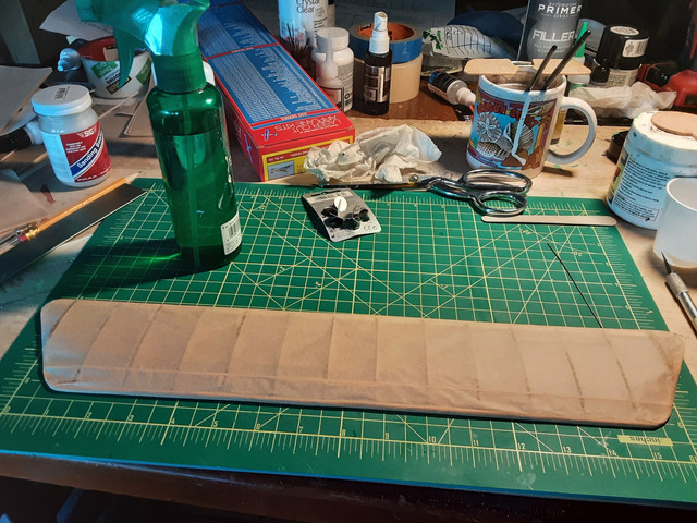 Here's the tissue, trimmed, with the overlap glued down, ready to be wetted. Note the spray bottle for misting.