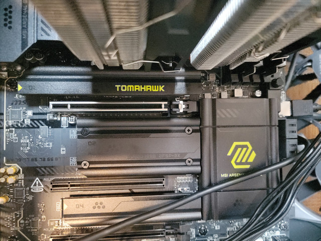 Cooler fins apparent on the bottom,  nvme1 under the "Tomahawk"