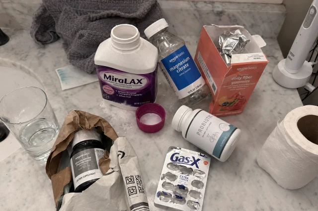 Bathroom counter cluttered with multiple digestive products