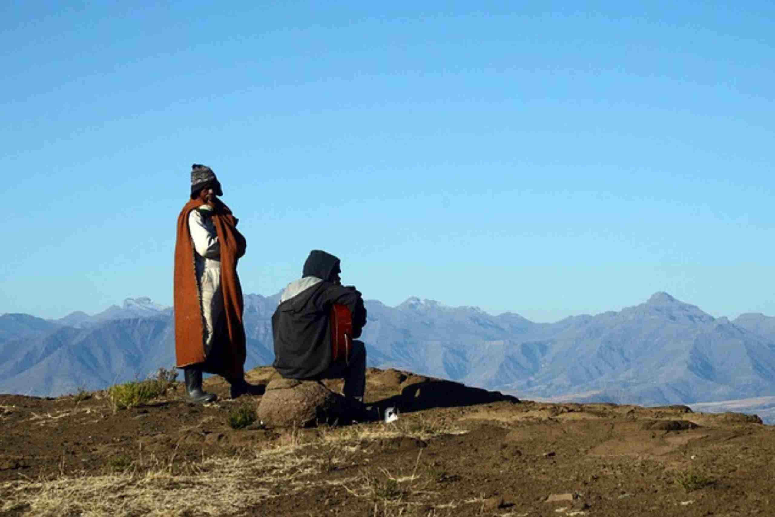 An image showing locals on the mountain landscape of Malealea.