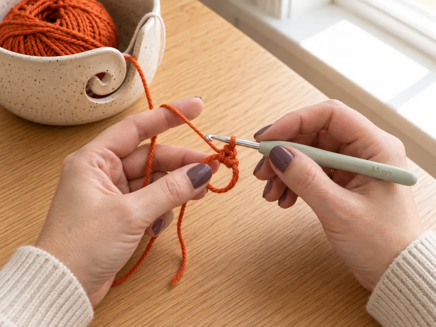 Start the body — Make a magic ring and crochet the first round that forms the top of the spider body.