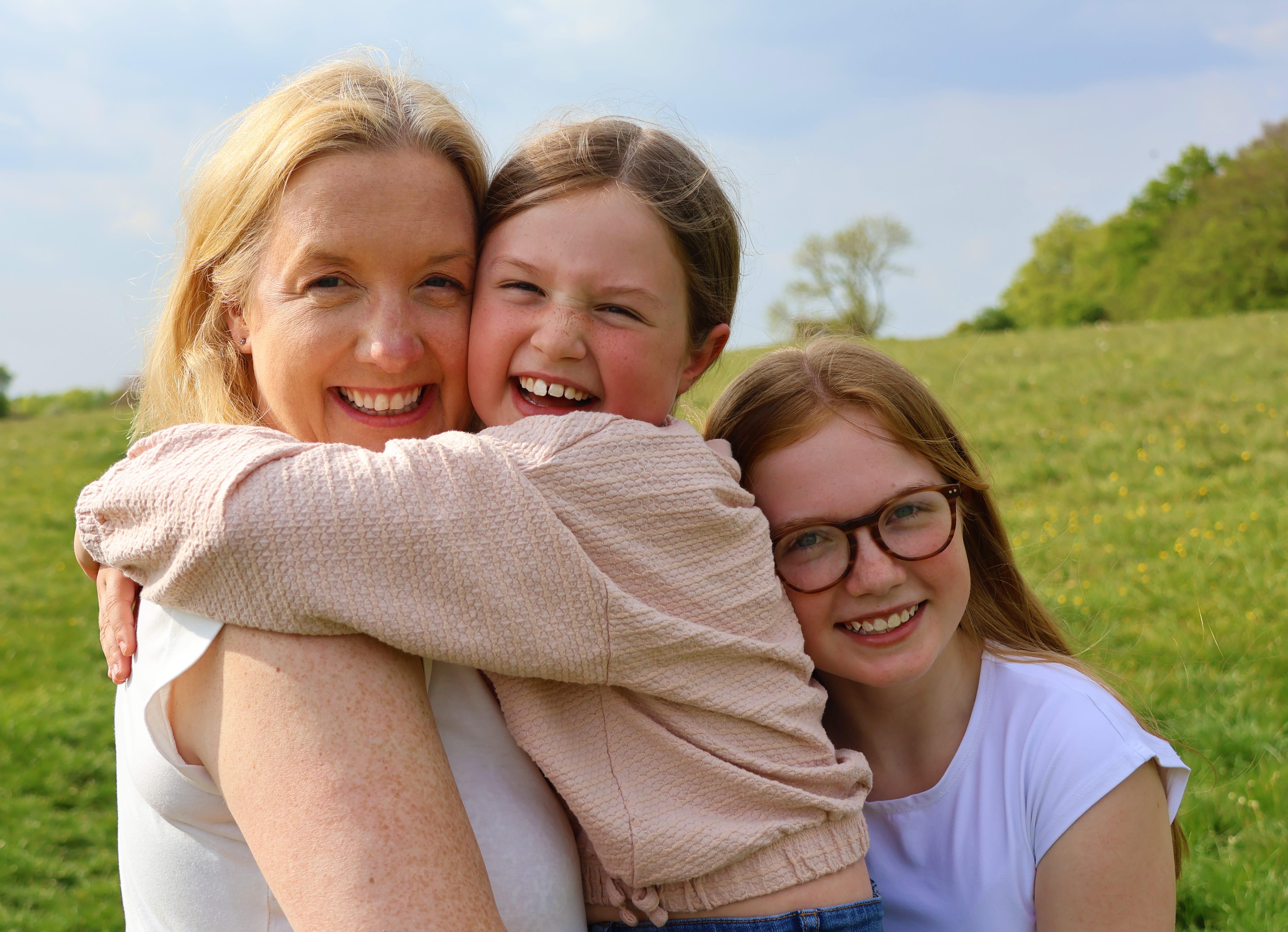 Mother with daughters in natural setting