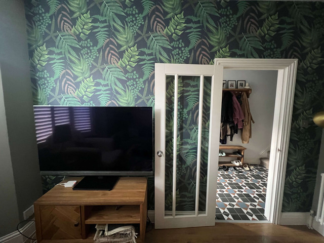 Living room with botanical wallpaper — East London