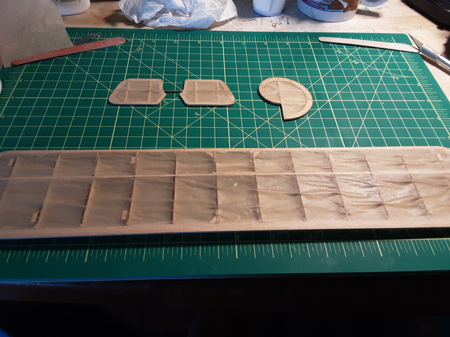 Wet with dope. Note that there are no puddles of dope in the wrinkles. This is one of those cases where thin coats work much better than using thicker coats. It's boring because it's a few minutes of work and then having to wait for it to dry.