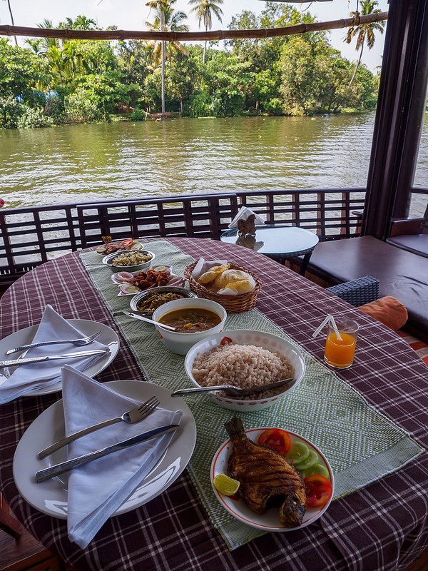 Freshly prepared Karimeen fish fry on banana leaf