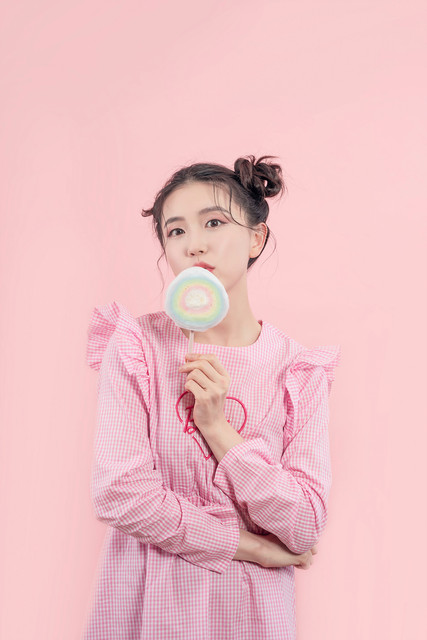 Girl holding rainbow