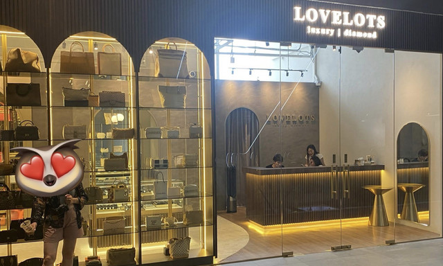 LoveLots luxury showroom facade and illuminated display cabinets at Orchard Central