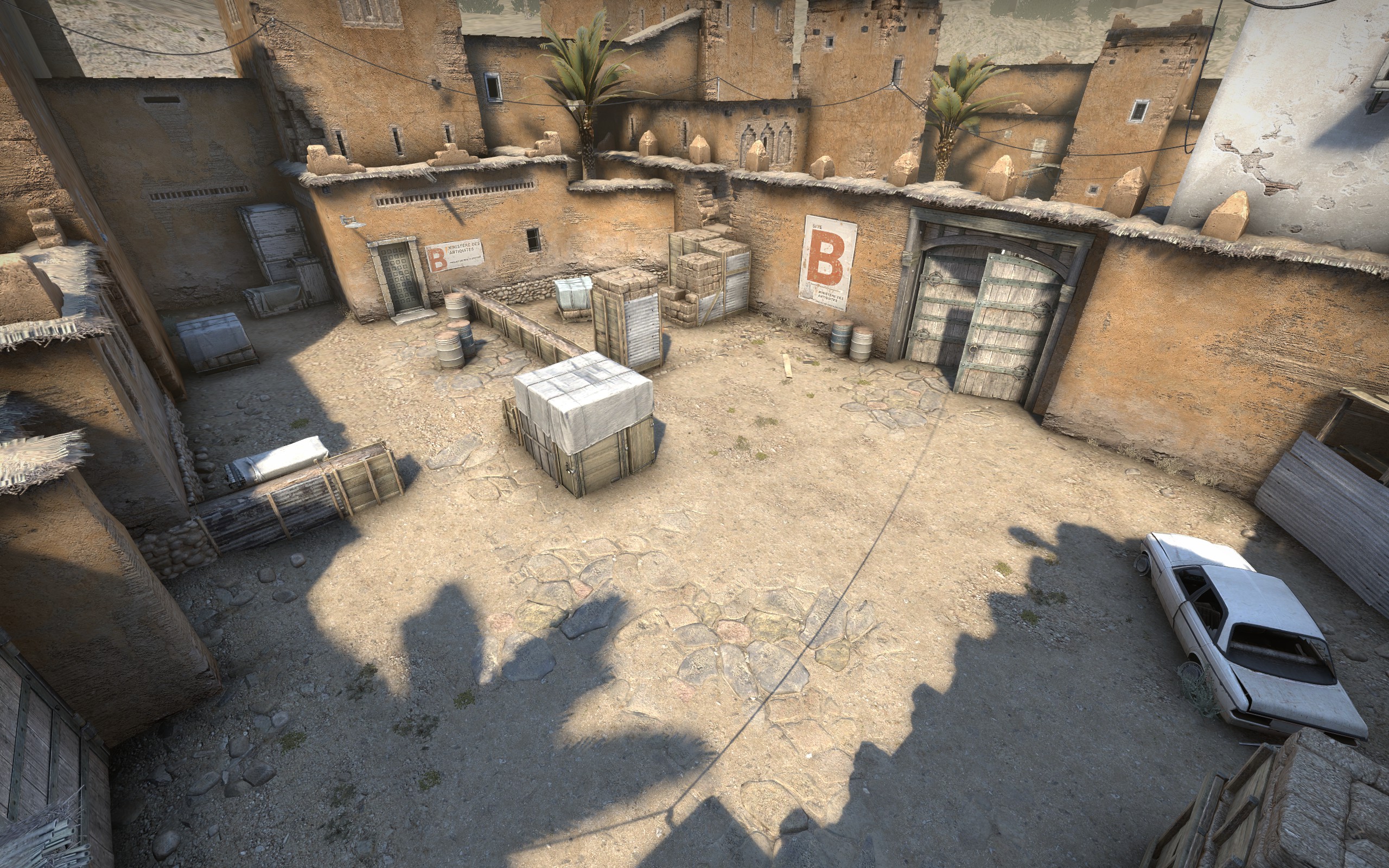 Bombsite B in CS:GO’s 2017 Dust II remake, showing the tunnel entrance, cover and double doors