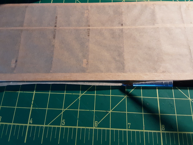On curved surfaces, like the topside of wings, it may be best to just put glue on the top of the ribs, let dry, trim, then apply glue to everything else and glue down the rest of the tissue. Applying tissue takes patience.
