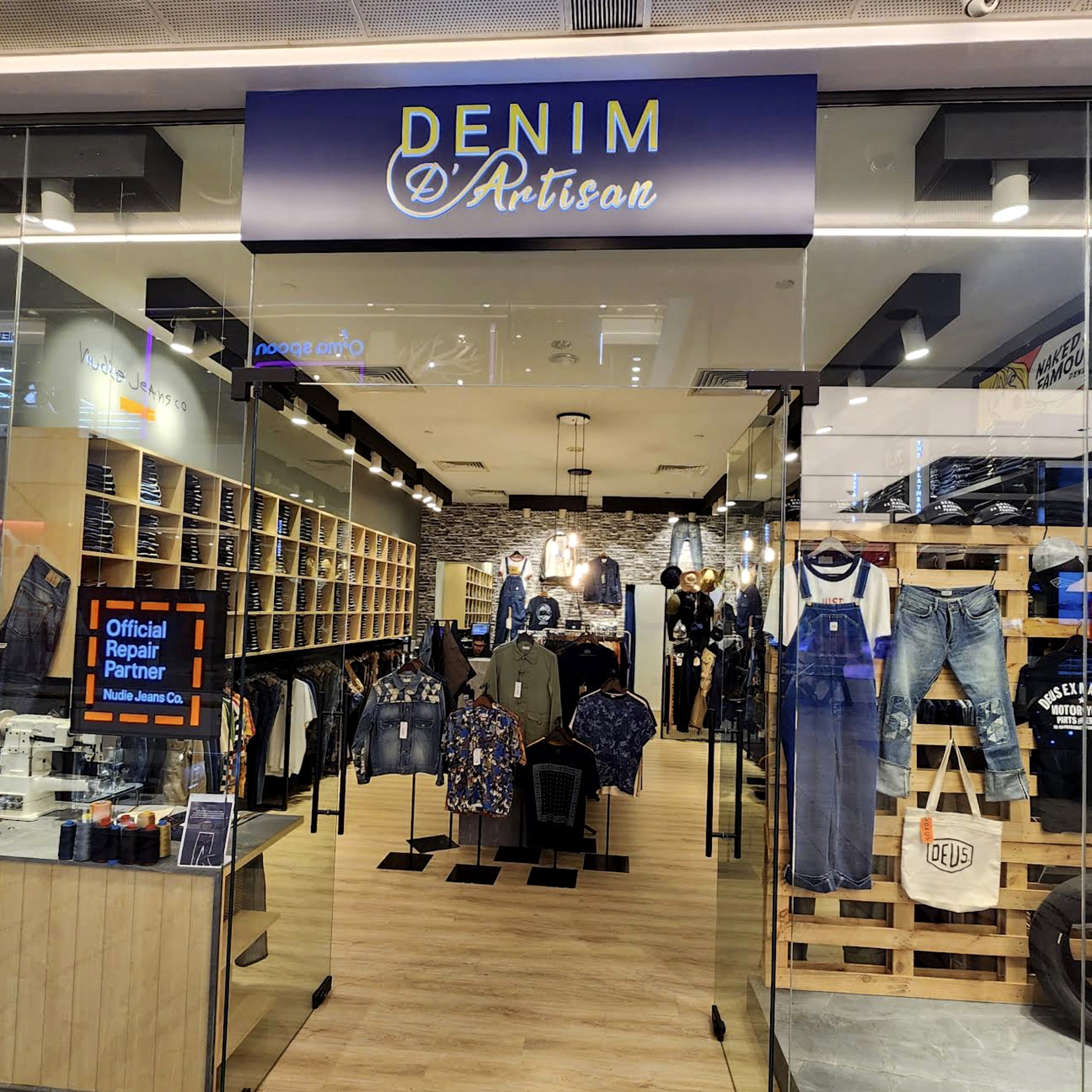 Denim jackets and leather goods at Denim D' Artisan