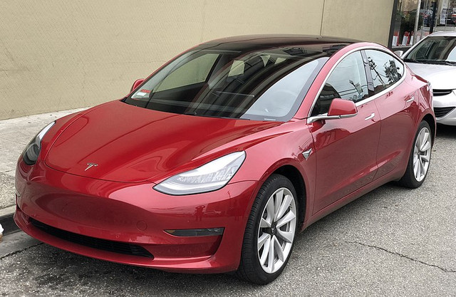 Tesla Model 3 — электрический пятиместный седан производства компании Tesla. Модель была представлена 31 марта 2016 года. Tesla Model 3 разработана на новой платформе, отличной от той, что используется в Tesla Model S и Tesla Model X. Автомобиль производится на основном заводе компании во Фримонте, штат Калифорния, аккумуляторы и электромоторы поставляет завод Gigafactory 1.Изначально электромобиль должен был называться Tesla Model Е, но компания Ford подала на Tesla Motors в суд, который и выиграла, получив право на название Model E[12][13].

1 апреля 2016 года в день презентации прототипа модели было открыто резервирование. К началу презентации компания получила 115 тыс. заявок. Всего за первые сутки машину зарезервировали 180 тыс. человек, внеся депозит в одну тысячу долларов. Это число превысило общее число продаж автомобилей компании за всю историю[14]. Число заказов за первые три дня достигло 276 тыс., за первую неделю — 325 тыс.[15][16], а к 16 мая 2016 года достигло 373 тыс.[17]. Через день после старта резервирования Илон Маск сообщил, что компания будет вынуждена пересмотреть собственный производственный план[18].

19 мая стало известно, что Tesla Motors продаст собственных акций на $1,4 млрд и пустит привлечённые средства на расширение производства до 500 тыс. автомобилей уже к 2018 году[17].

31 мая 2016 года на ежегодном собрании акционеров Илон Маск объявил, что владельцы Model 3 будут платить за пользование фирменной сетью зарядных станций Supercharger или должны приобрести соответствующую опцию. Причиной этого решения компания назвала желание максимально уменьшить начальную стоимость автомобиля[19].

2 июня Маск сообщил, что разработка Model 3 практически завершена, и компания планирует окончить разработку через шесть недель, оставив любые новые идеи для следующих версий. Также было объявлено, до конца 2016 года состоится мероприятие, посвящённое Model 3. Издание The Verge предполагает, что речь шла о презентации готовой к производству версии электромобиля[20].

28 июля 2017 года журналистам и сотрудникам компании были представлены первые 30 серийных Tesla Model 3. Приоритет в очереди на получение достался сотрудникам компании[21].

Первые поставки не связанные с компанией заказчикам планировались на ноябрь—декабрь 2017 года[21]. Поставки Tesla Model 3 в стандартной комплектации за 35 000$ планировалось начать в конце 2017, а весной 2018 года поставлять версии с 2 моторами (D), в дальнейшем с улучшенной производительностью (PD). Первые поставки Tesla Model 3 за пределы США планировалось начать в конце 2018, а выпуск версии с правым рулём только в 2019 году.[22]

В 3 квартале 2017 года было произведено 260 Tesla Model 3[23].

В 4 квартале 2017 года произведено 2425 автомобилей[24].

В 1 квартале 2018 года произвели 9766 автомобилей[25].

Во 2 квартале 2018 года было произведено 28 578 автомобилей[26]. До 2 квартала 2018 в производстве была только Long Range версия с одним мотором(RWD).

Во 2 квартале 2018 года началось производство и поставки версии с двумя моторами и улучшенной производительностью. Для всех вышеперечисленных версий предполагаемый запас хода составляет 310 миль(500 км)[27].

В 3 квартале 2018 года было произведено 53 239 автомобилей, причём электромобилей с двумя моторами было произведено больше, чем с одним.[28] 13 октября 2018 года с конвейера сошел электромобиль Tesla Model 3 под порядковым номером 100 000.[29]

В 4 квартале 2018 года было произведено 61 394 автомобилей, всего за 2018 год было изготовлено 145 846 экземпляров Model 3.[30] Таким образом, Model 3 стала самым продаваемым электромобилем в 2018 году, обойдя Nissan Leaf и BAIC EC. И это несмотря на то, что в 2018 году цена на самые доступные модификации Model 3 была от 45 000 долларов(производство базовой версии ценой от 35 000 долларов планируют запустить в 2019 году) , а продажи за пределами Северной Америки ещё не начались.[31]

В 1 квартале 2019 года было произведено 62 950 Model 3, во втором квартале 2019 года - 72 531 Model 3[32][33]. В первом квартале 2019 года начались продажи Model 3 за пределами Северной Америки, прежде всего в Европе и Китае. В первом-втором квартале 2019 года в Европе были доступны только машины с левым рулём и в дорогих комплектациях. Первые Model 3 с правым рулём прибыли в Великобританию в конце июня-начале июля 2019 года.