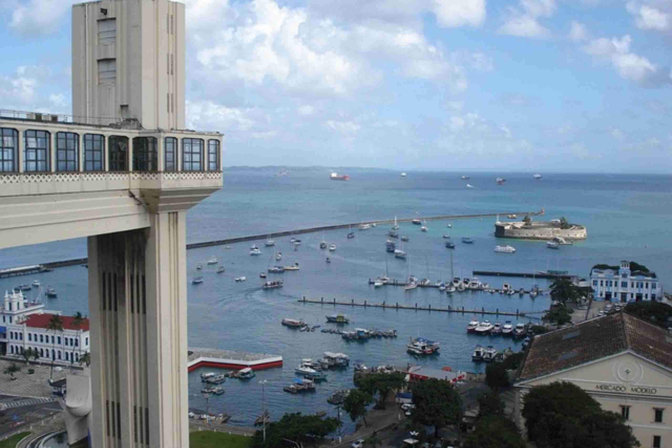 An image showing the panoramic coastal view from Elevador Lacerda in Salvador, Bahia.