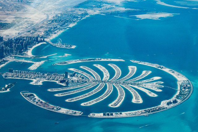 Aerial view of Palm Jumeirah in Dubai – a prime property hotspot offering luxury residences, waterfront living, and strong investment potential for international buyers.
