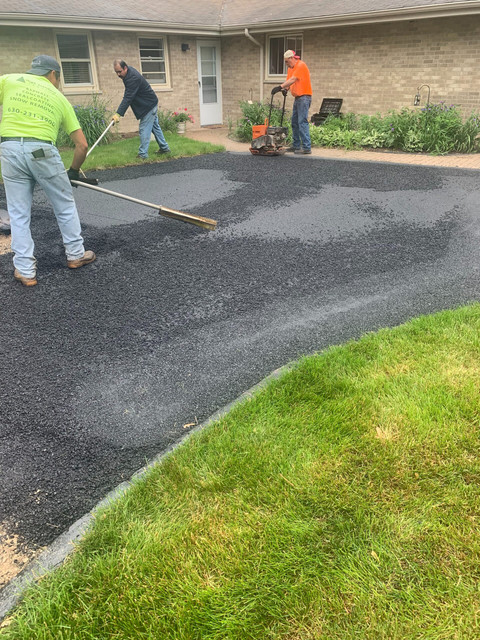 Rock Ridge Paving and Concrete crew finishing a driveway pour in St. Thomas