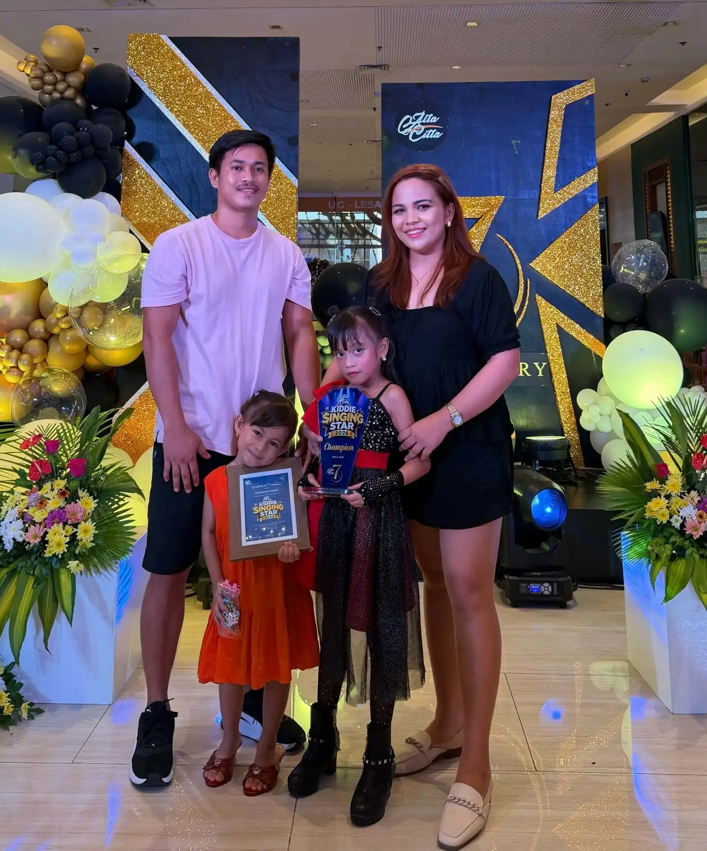 Jilean Shain Taghap with her family, whose support shaped her journey