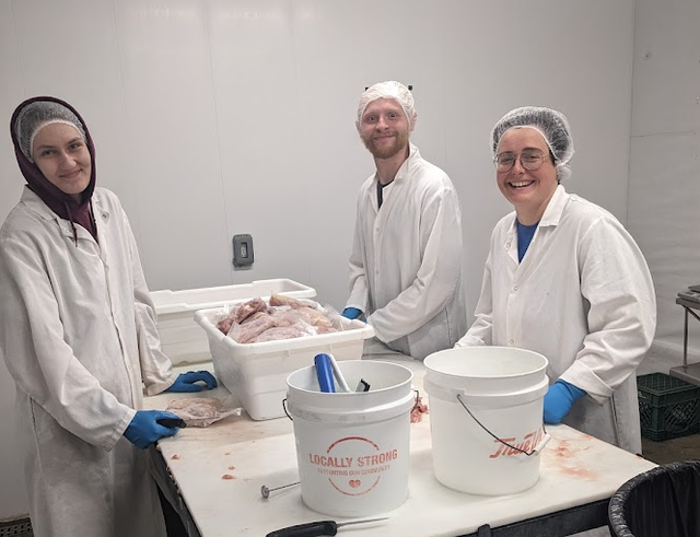On-farm processing team handling birds humanely