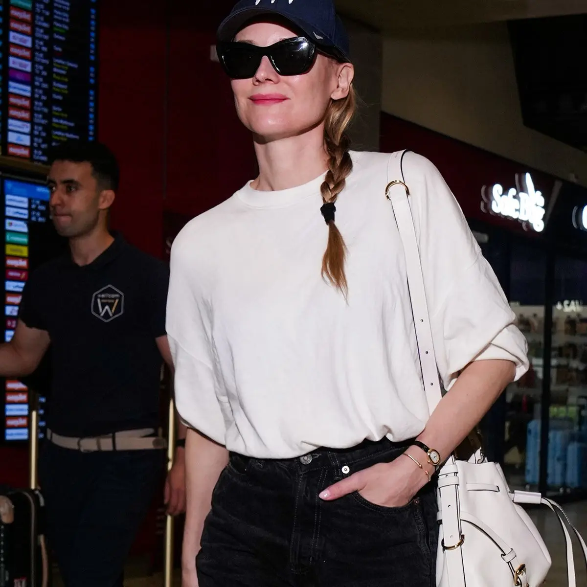 Women in Their 40s Swap Sneakers for Chic Shoes at Cannes Airport