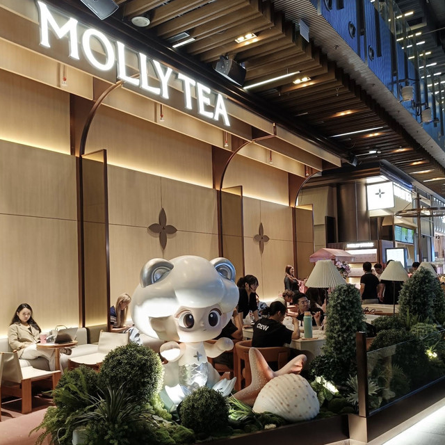 MOLLY TEA Orchard Central interior and signature mascot display