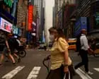 New Yorkers Face Smoky Skies and Rising Heat