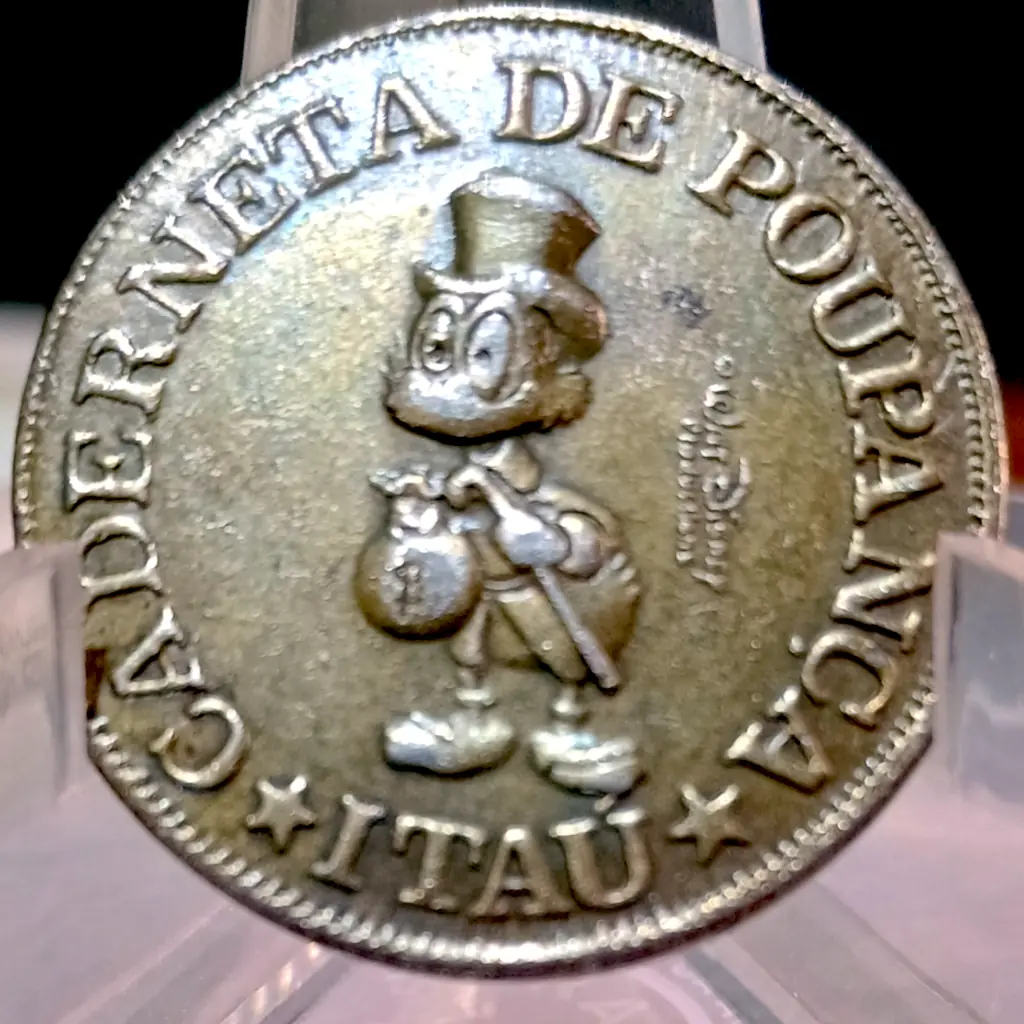 Rara Moeda de 1 Pataca do Tio Patinhas – Banco Itaú S/A Crédito Imobiliário – MBC+