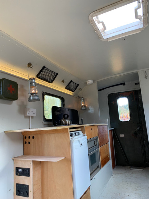 Fitted a skylight. A 3-way fridge, oven, instant water heater, sink and hob.