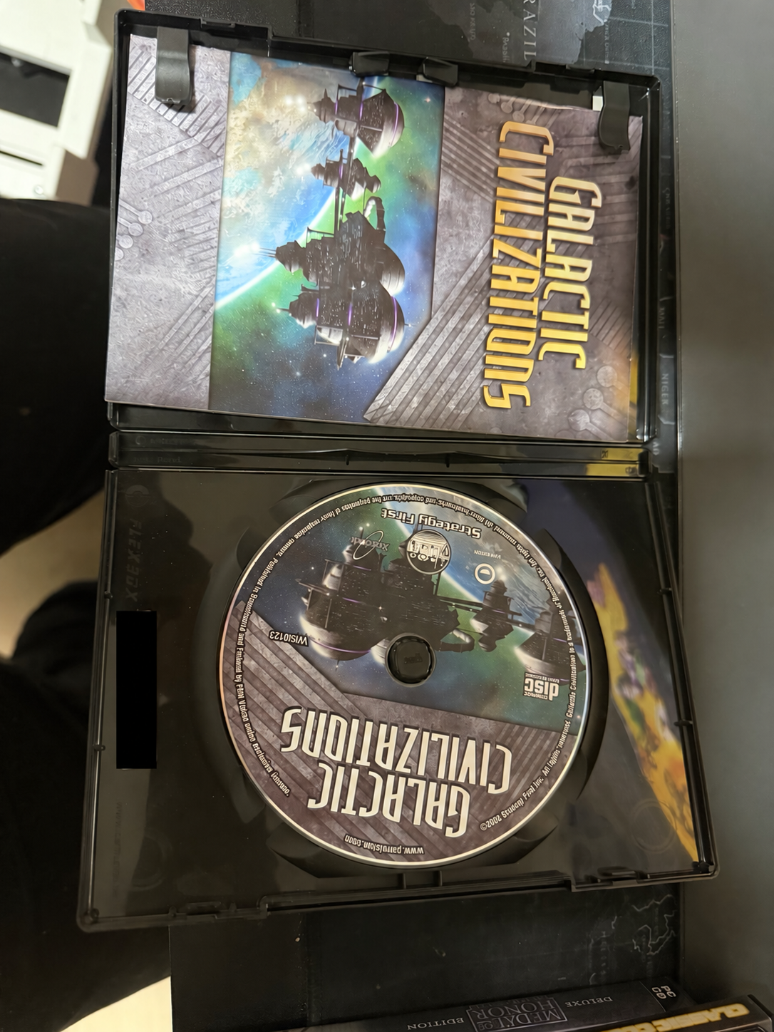 Galactic Civilizations manual and CD inside the case; key covered