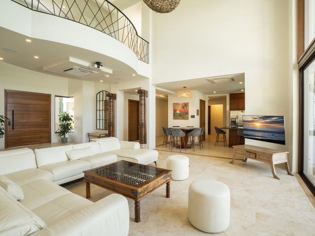 Modern living room in a Jaco home showcasing comfortable indoor lifestyle and entertainment amenities appealing to foreign buyers in Costa Rica
