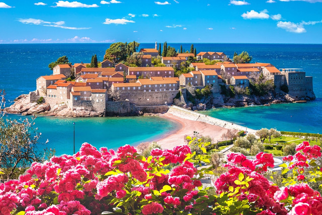 Sveti Stefan island village and beach in Montenegro with turquoise Adriatic Sea, a top destination featured in LeadingRE’s 2025 travel guide to must-visit places in Montenegro.