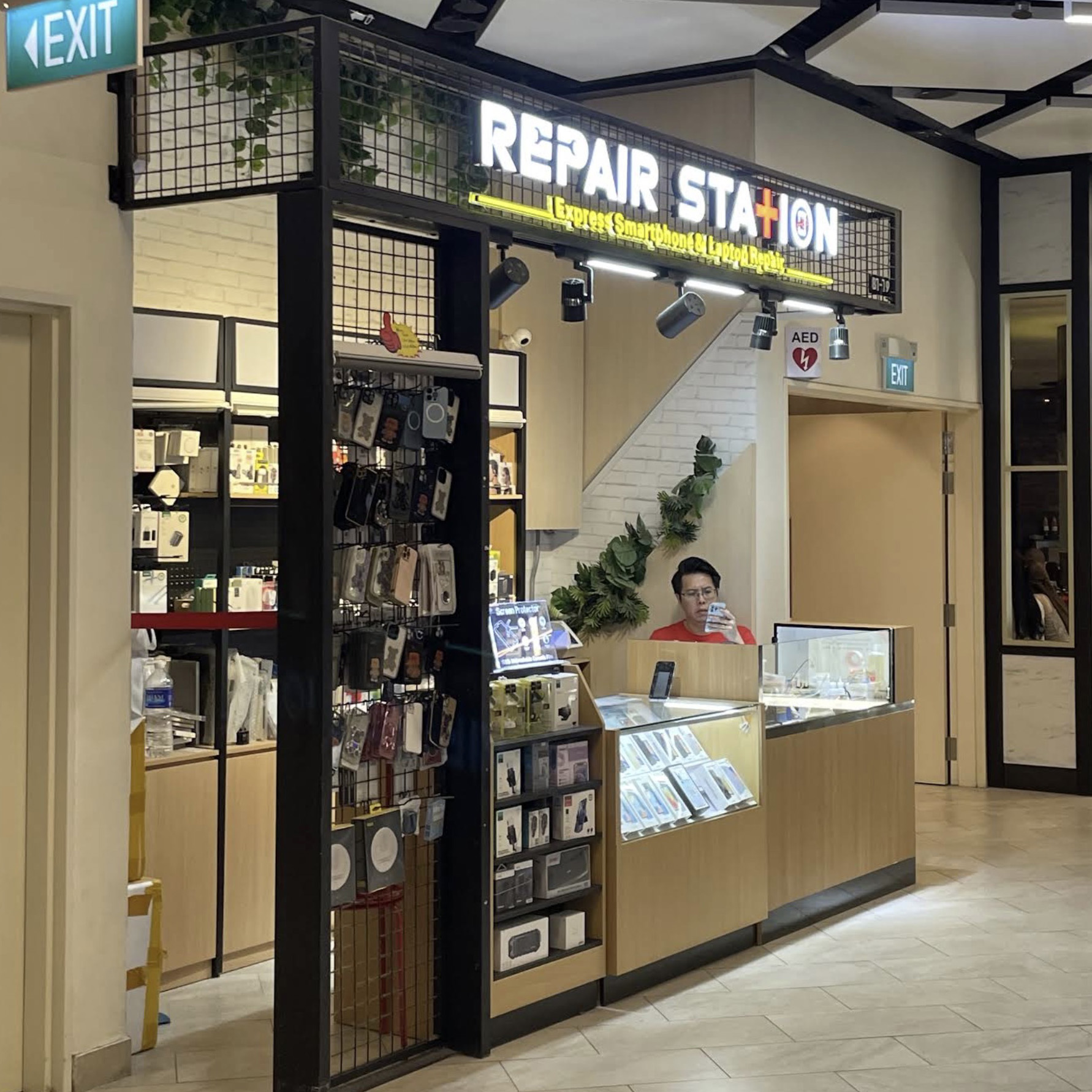 Repair Station smartphone and laptop repair counter at PLQ Mall