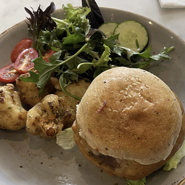 Vegetarian burger and salad served at Real Food