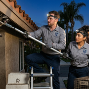 Pest control technician inspecting property in Anaheim