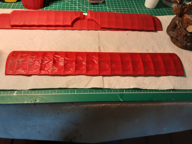 Apply the diluted dope carefully with a soft brush. Hold the part at a 45° angle and hold the brush with the bristles pointing slightly upward. Dipping the brush in the dope is called "loading" the brush. Don't overload the brush and slop it on. After applying the dope, go back over it with an unloaded brush to wick away any excess dope. Excess dope will collect in puddles. When it dries, you end up with blobs of dope all over the tissue. It's ugly. So, use an unloaded brush to remove excess dope. Unload a brush by wiping it on a paper towel. Excess dope shows up as white. If theres visible white liquid, it needs to be removed. Some builders wick excess dope off the tissue with paper towels. As you can see from the picture, there's no excess dope on the wing. Be gentle at all times because wet tissue is some fragile stuff. Only do one side of the parts at a time and be sure there isn't any dope that will come in contact with the surface on which the part is placed on to dry, or it will glue the part to the surface.