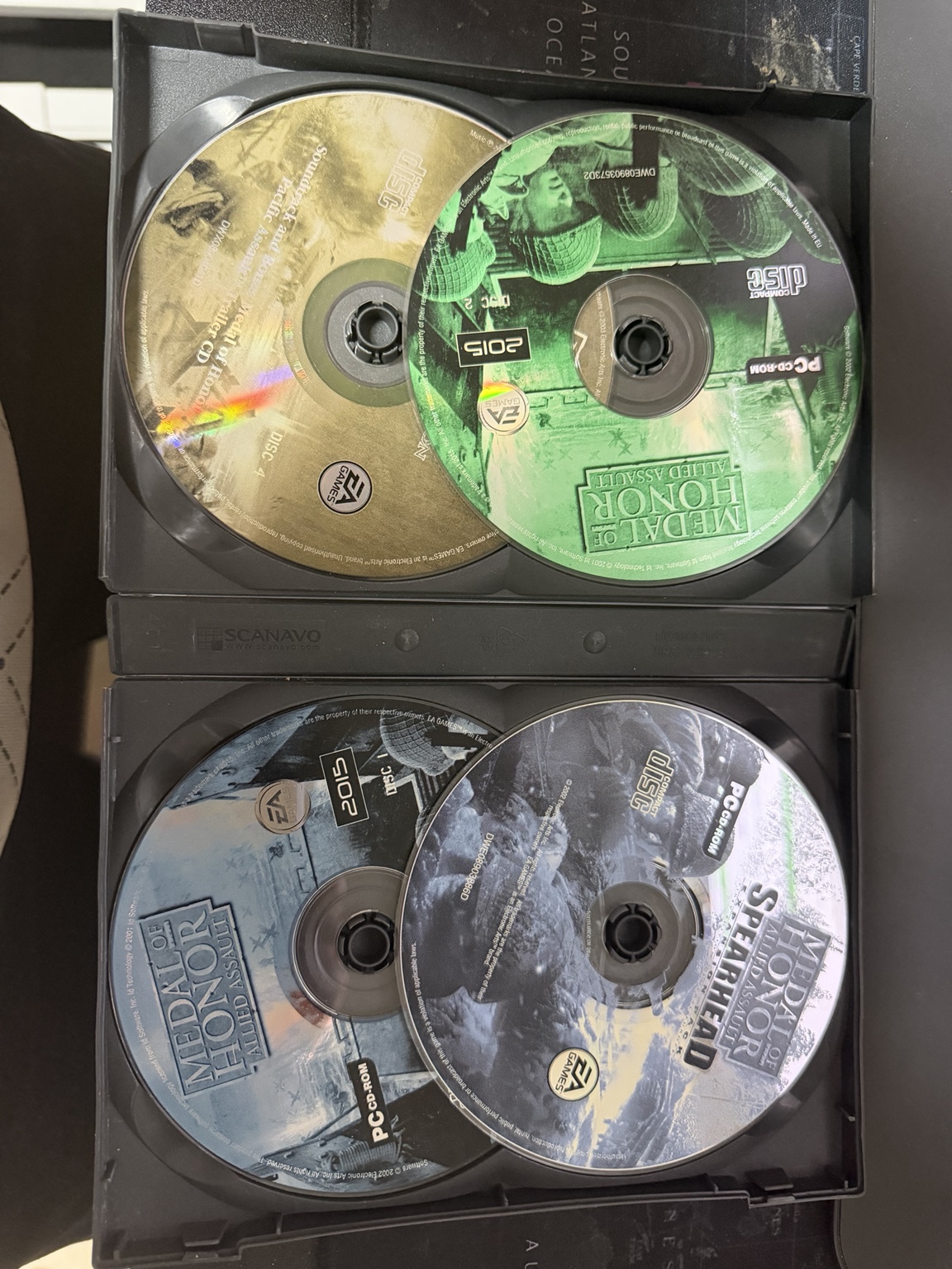 Allied Assault discs 1 and 2, Spearhead and soundtrack CD in the trays