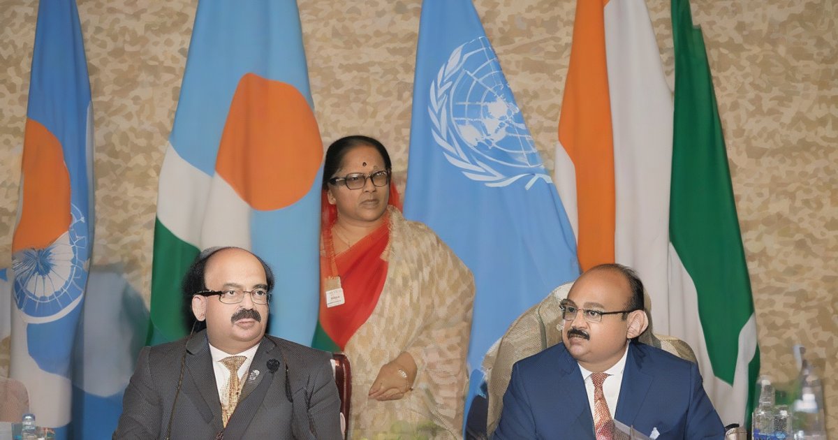 Diplomatic meeting room with Indian and Bangladeshi flags on table, documents and globes symbolizing bilateral talks