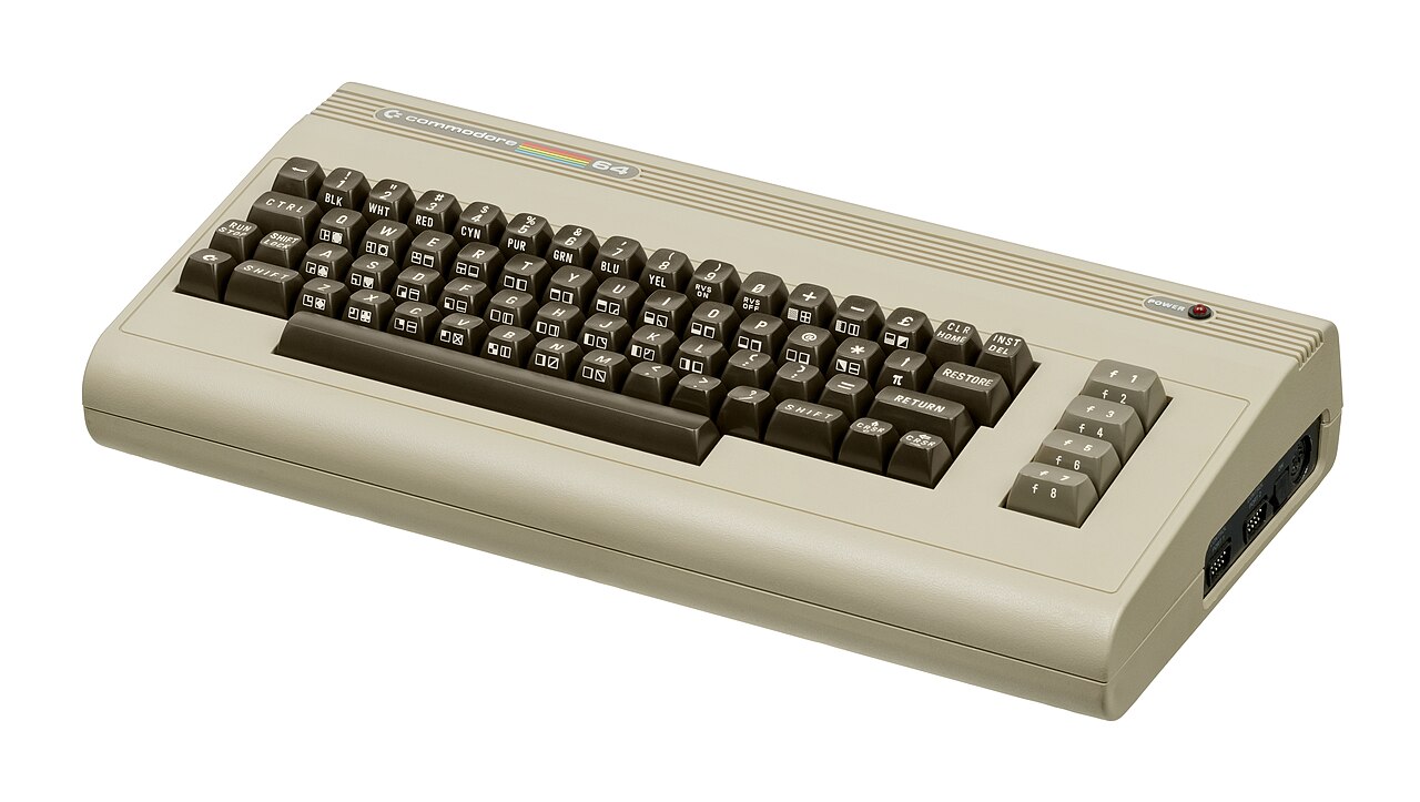 A beige Commodore 64 home computer photographed against a white background