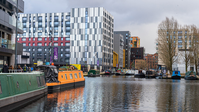 Modern canal side apartments in New Islington Manchester showcasing one of the top UK locations attracting tech savvy professionals and remote workers seeking urban lifestyle and connectivity