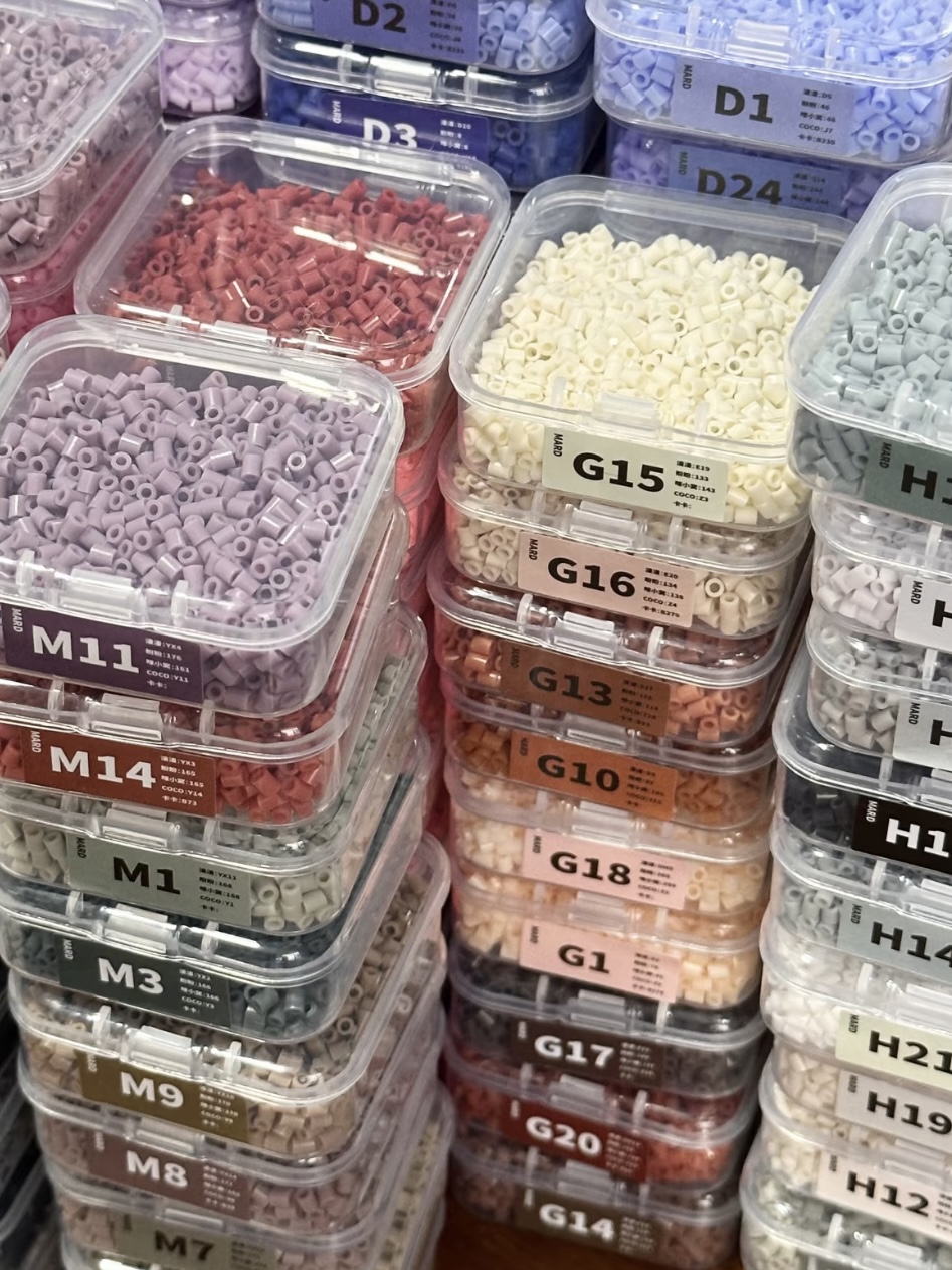 Small portable Perler bead storage box with independent clear grids and compact size