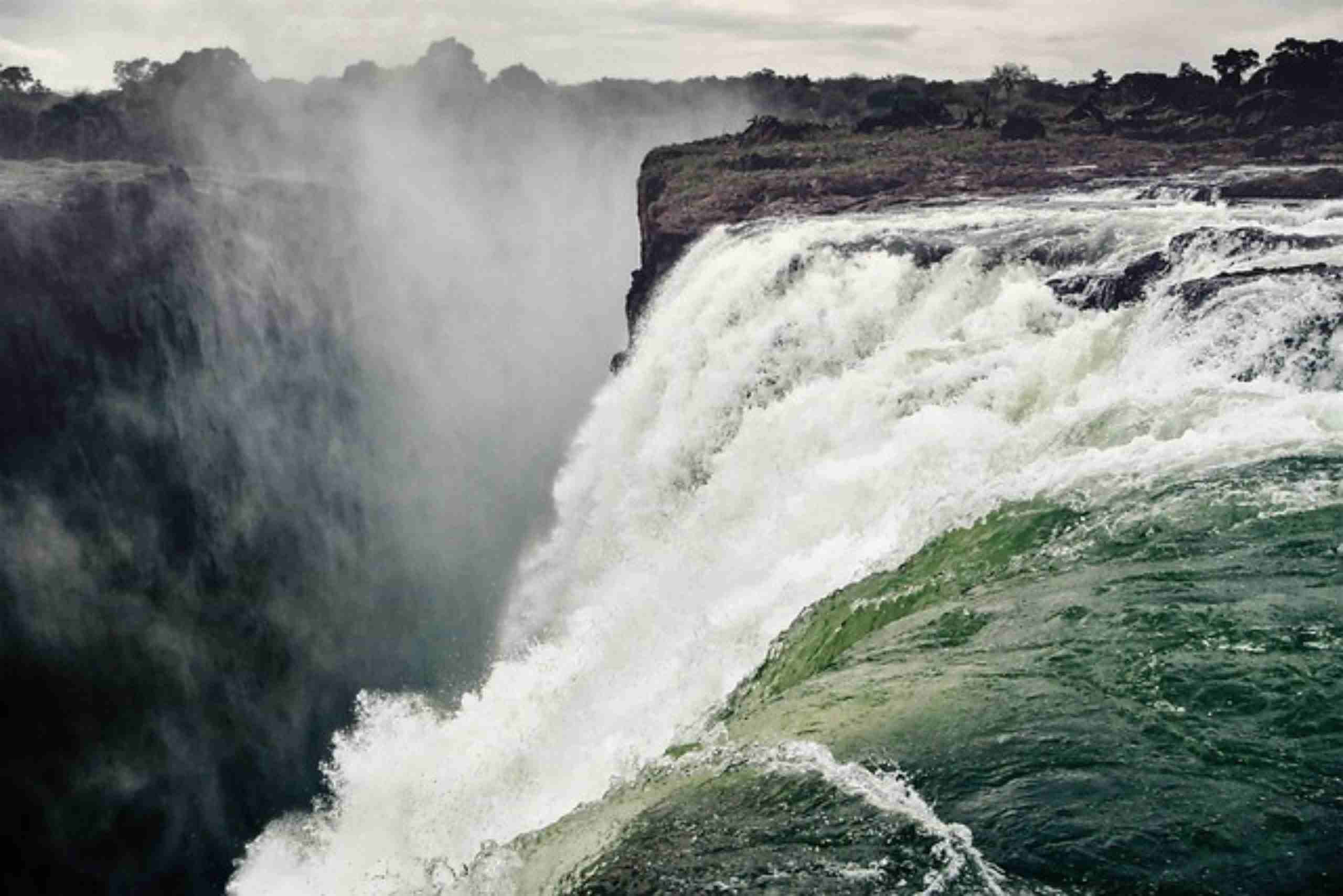 An image showing Victoria Falls in Zambia, a magnificent natural wonder with cascading water.