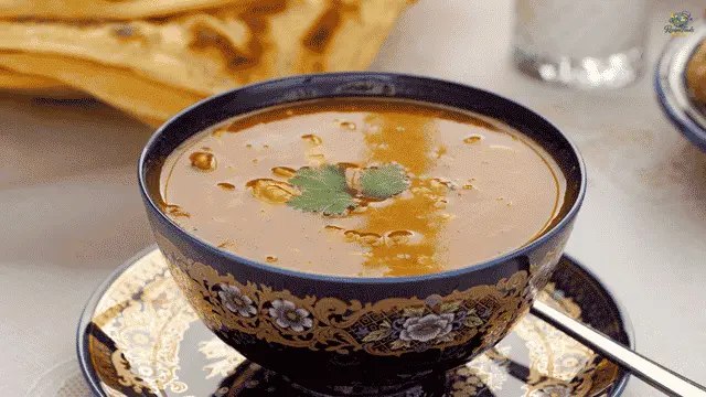 Moroccan Harira Soup A bowl of authentic Moroccan Harira soup garnished with fresh cilantro.