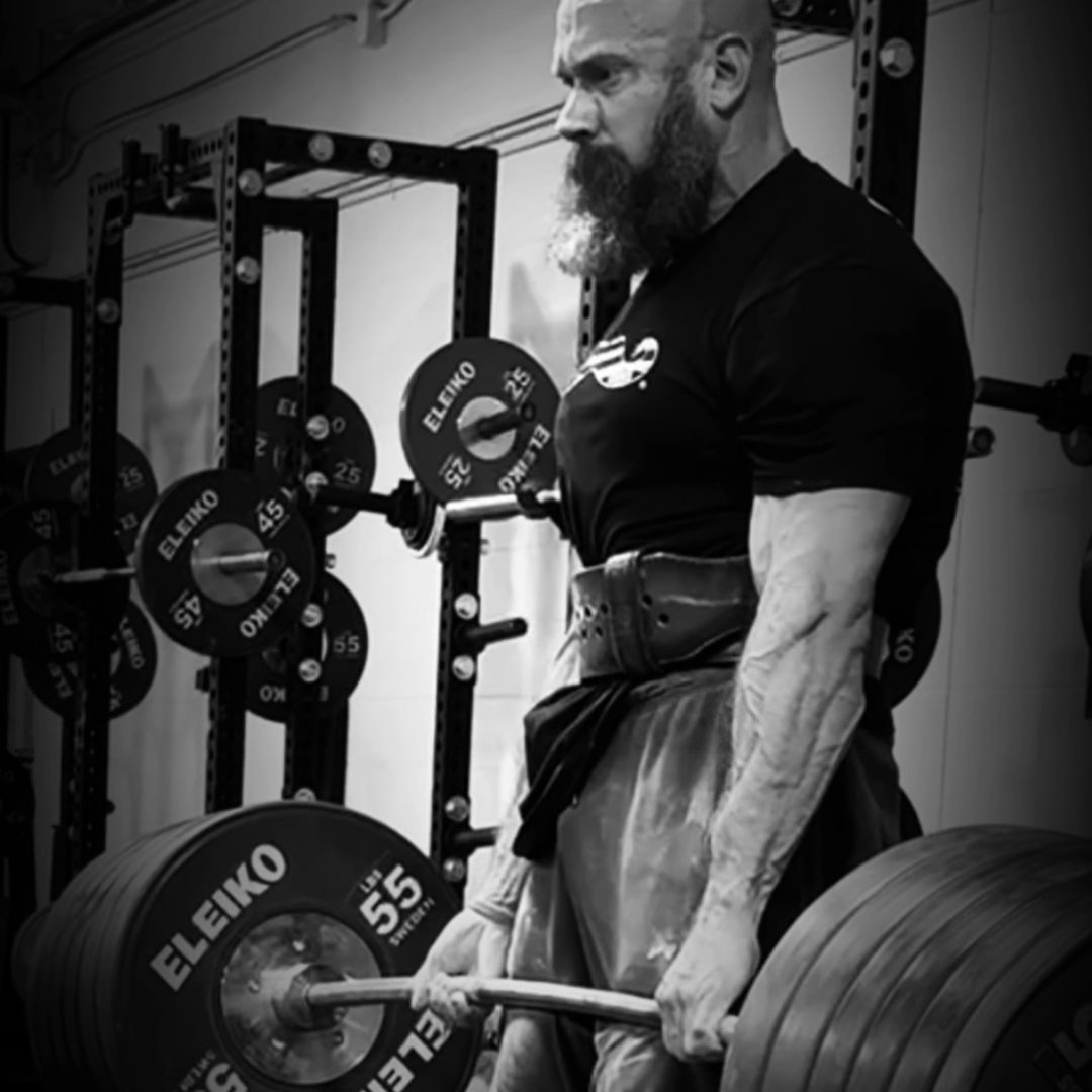 Athlete training with heavy barbell