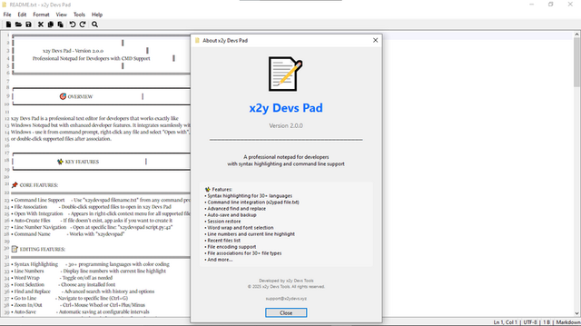 x2y Devs Pad v2.0.0 editor interface showing syntax-highlighted code with line numbers, file tabs and status bar in a clean dark theme