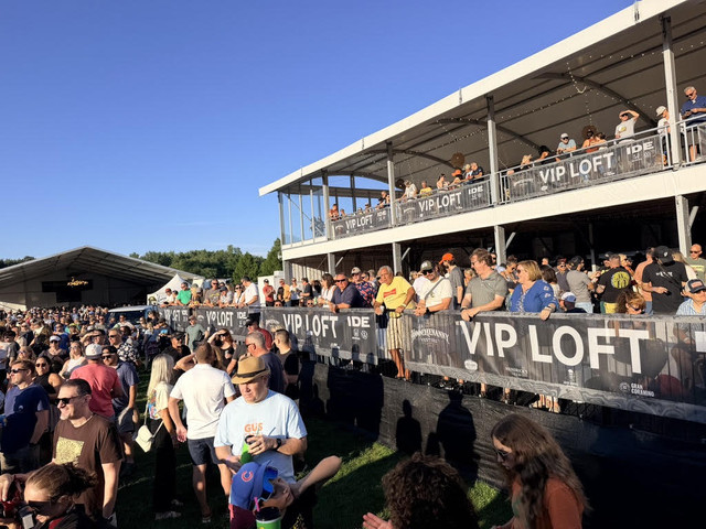 Festivalgoers gathered near the Ide Family of Dealerships VIP Loft