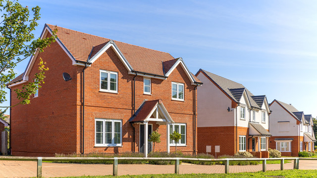 Row of new build modern detached houses in the UK offering energy efficiency accessible design and low maintenance living ideal for retirees seeking long term comfort