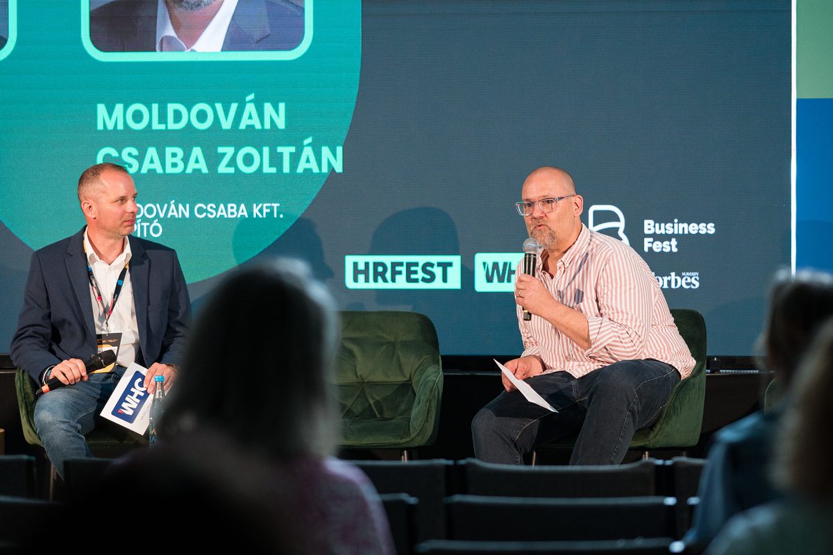 Csaba Moldován speaking on stage at Business Fest