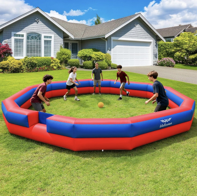 Kids playing gaga ball in inflatable pit